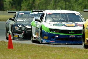 Shane Lewis' Chevy Camaro and Justin Haley's Ford Mustang