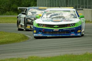 Gar Robinson's Chevy Camaro and Justin Haley's Ford Mustang