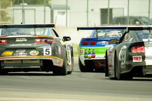 Gar Robinson's Chevy Camaro, Lawrence Loshak's Chevy Camaro and Justin Haley's Ford Mustang