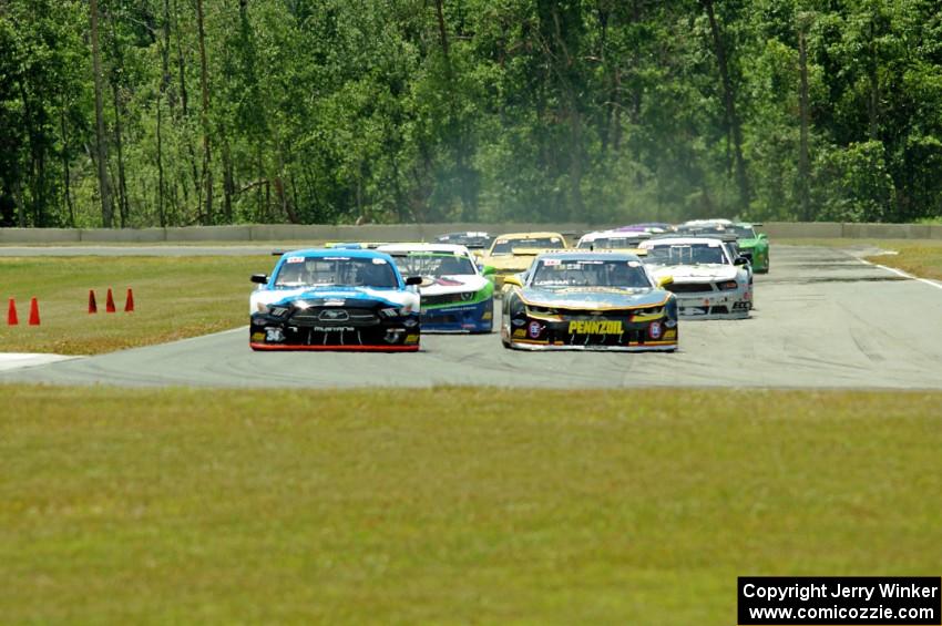 First lap: Lawrence Loshak's Chevy Camaro passes Tony Buffomante's Ford Mustang for the lead out of turn 3 into turn 4.