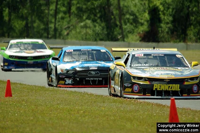 Lawrence Loshak's Chevy Camaro, Tony Buffomante's Ford Mustang and Gar Robinson's Chevy Camaro