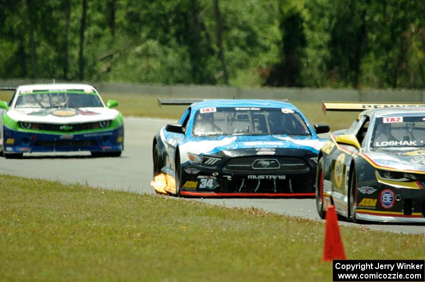 Lawrence Loshak's Chevy Camaro, Tony Buffomante's Ford Mustang and Gar Robinson's Chevy Camaro