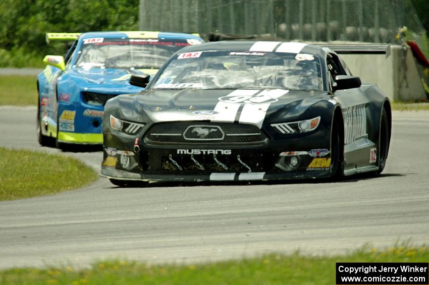Justin Haley's Ford Mustang and Tommy Archer's Chevy Camaro