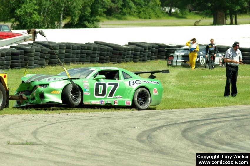 Jordan Bernloehr's Chevy Camaro is towed aff the track after the race.