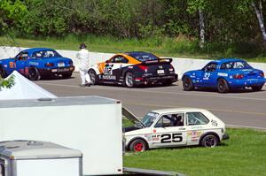 Gordon Kuhnley's Spec Miata Mazda Miata, Patrick Price's T3 Nissan 350Z and Paul Pridday's Spec Miata Mazda Miata