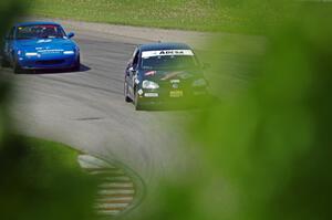 Tom Daly's STU VW Rabbit and Paul Pridday's Spec Miata Mazda Miata