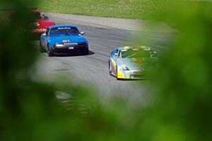 Doug Karon's GT-3 Nissan 350Z, Gordon Kuhnley's Spec Miata Mazda Miata and Ed Dulski's GT-1 Olds Cutlass Supreme