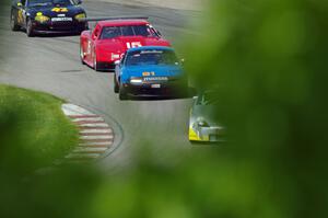 Doug Karon's GT-3 Nissan 350Z, Gordon Kuhnley's Spec Miata Mazda Miata, Ed Dulski's GT-1 Olds Cutlass Supreme and Greg Youngdahl