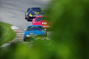 Doug Karon's GT-3 Nissan 350Z, Gordon Kuhnley's Spec Miata Mazda Miata, Ed Dulski's GT-1 Olds Cutlass Supreme and Greg Youngdahl