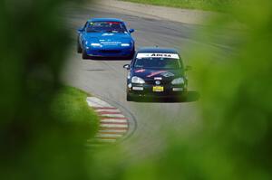 Tom Daly's STU VW Rabbit and Paul Pridday's Spec Miata Mazda Miata