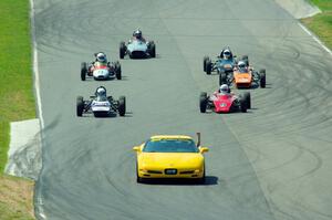 The field streams between turns five and six on the pace lap.