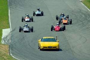 The field streams between turns five and six on the pace lap.