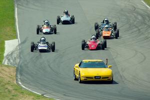 The field streams between turns five and six on the pace lap.