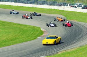 The field streams into turn eleven on the pace lap.