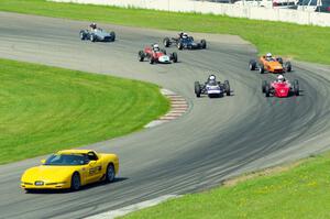 The field streams into turn eleven on the pace lap.