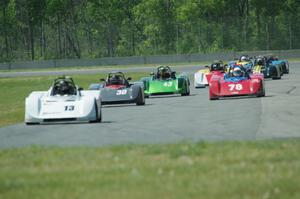 The field streams into turn four on the first lap.