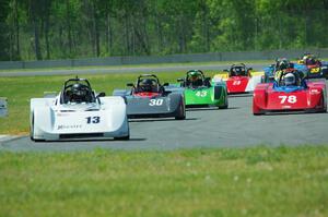 The field streams into turn four on the first lap.