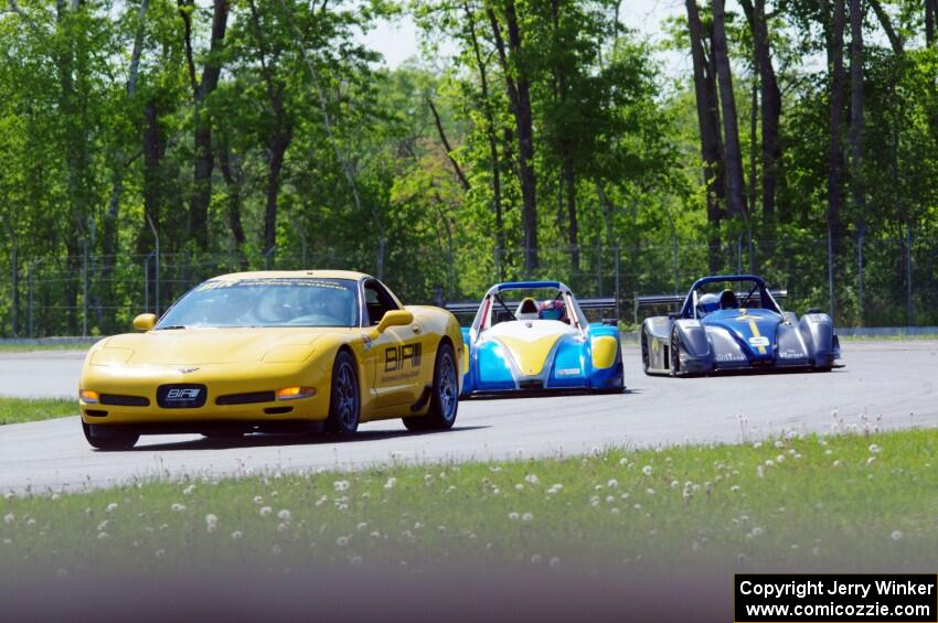 Jose Borrero's and Nate Smith's P2 Radical SR3s on the front row behind the pace car.