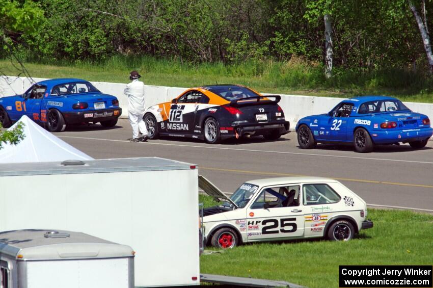 Gordon Kuhnley's Spec Miata Mazda Miata, Patrick Price's T3 Nissan 350Z and Paul Pridday's Spec Miata Mazda Miata