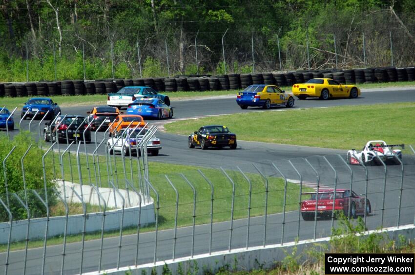 The field streams into turns seven and eight on the pace lap.