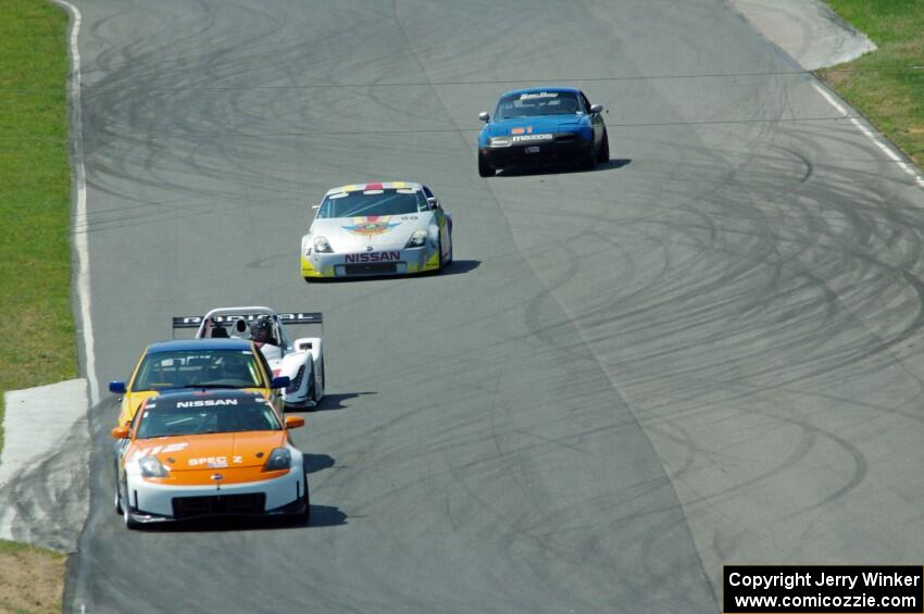 The front portion of the field comes through turns five and six on the first lap.