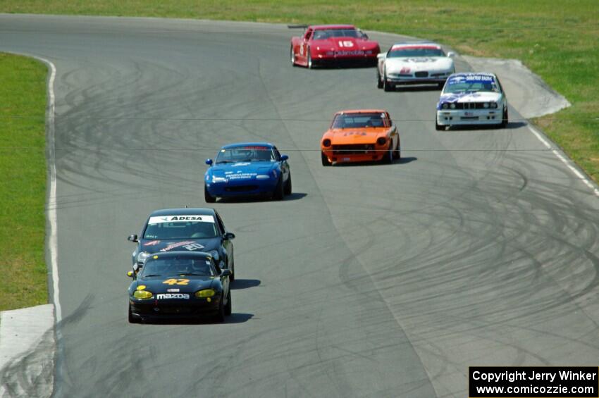 A portion of the field streams between turns five and six on the first lap.