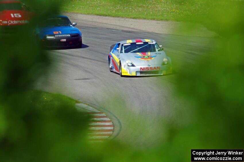 Doug Karon's GT-3 Nissan 350Z, Gordon Kuhnley's Spec Miata Mazda Miata and Ed Dulski's GT-1 Olds Cutlass Supreme