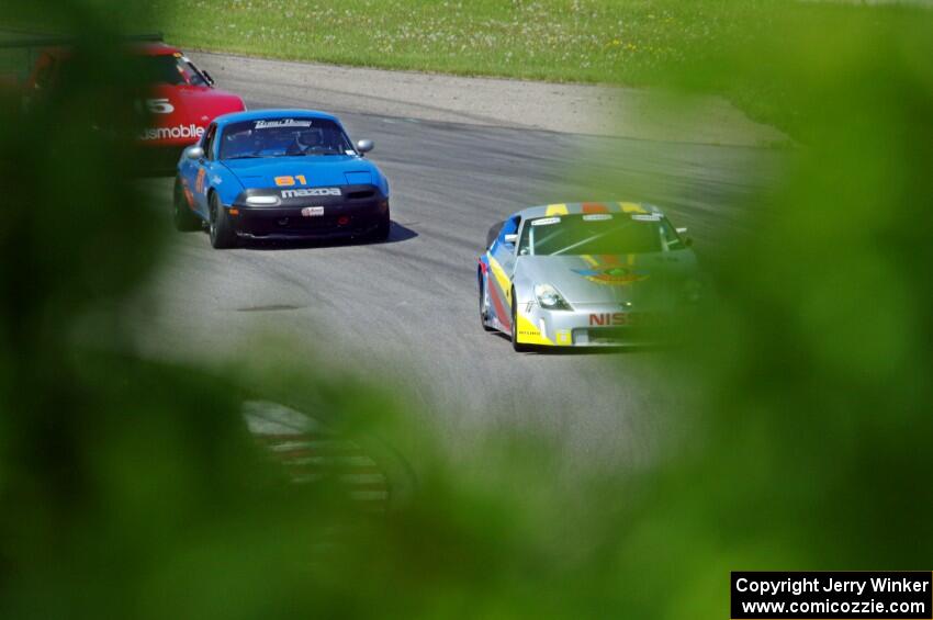 Doug Karon's GT-3 Nissan 350Z, Gordon Kuhnley's Spec Miata Mazda Miata and Ed Dulski's GT-1 Olds Cutlass Supreme