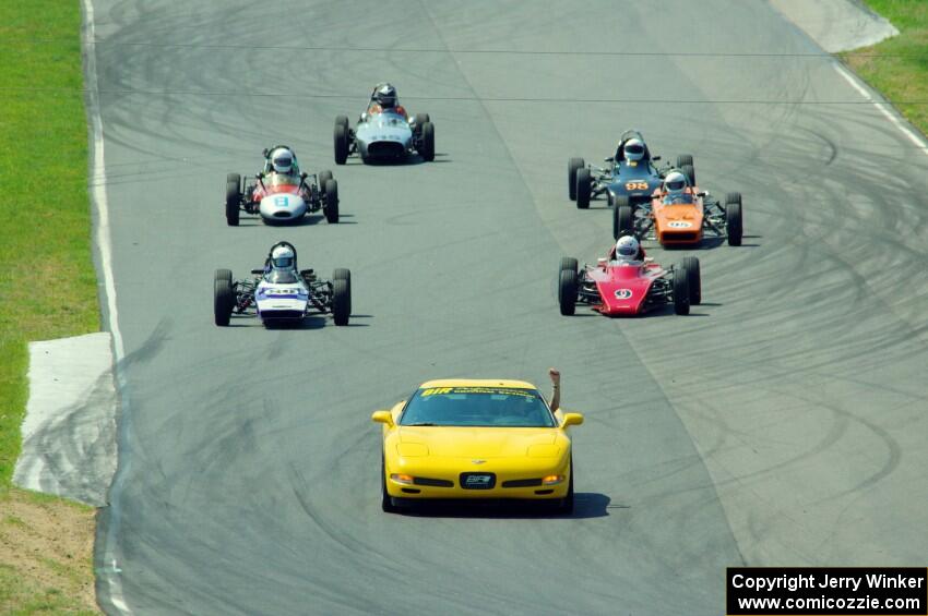 The field streams between turns five and six on the pace lap.