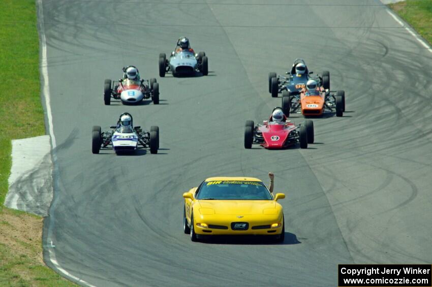 The field streams between turns five and six on the pace lap.
