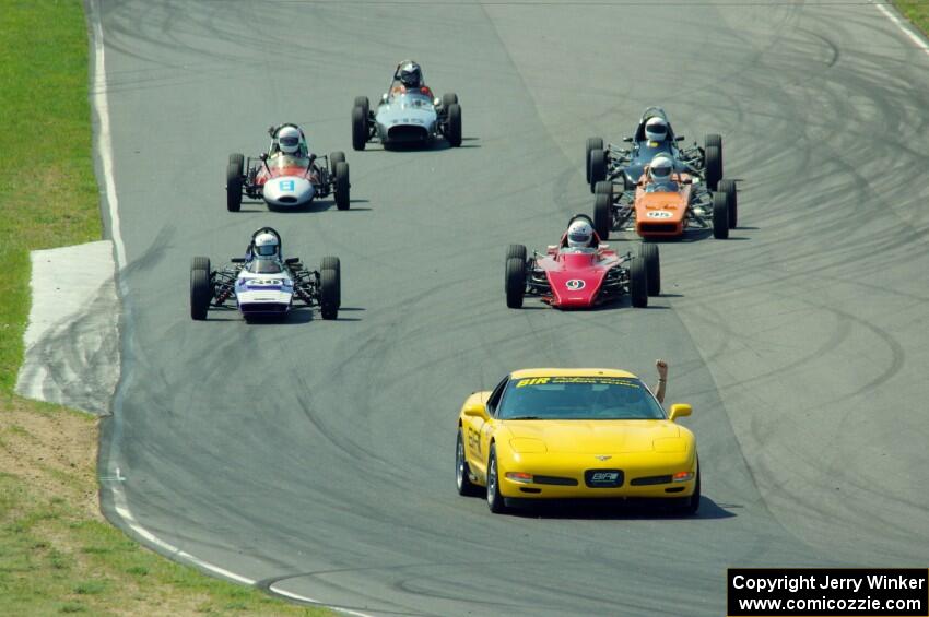 The field streams between turns five and six on the pace lap.