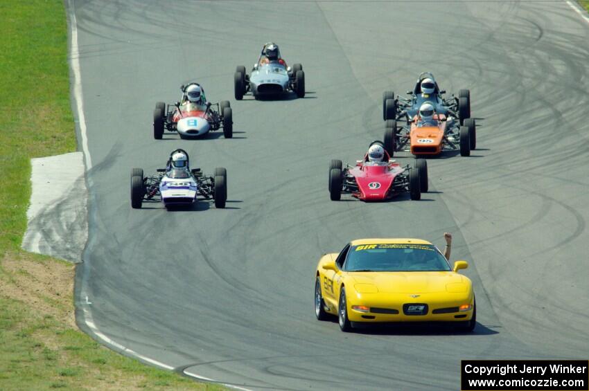 The field streams between turns five and six on the pace lap.