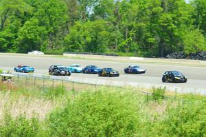 The Spec Miata and smaller production class field comes into turn 1 afier getting the green flag.