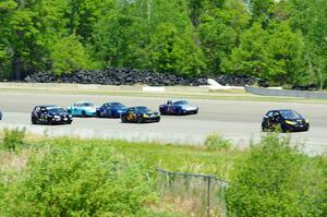 The Spec Miata and smaller production class field comes into turn 1 afier getting the green flag.