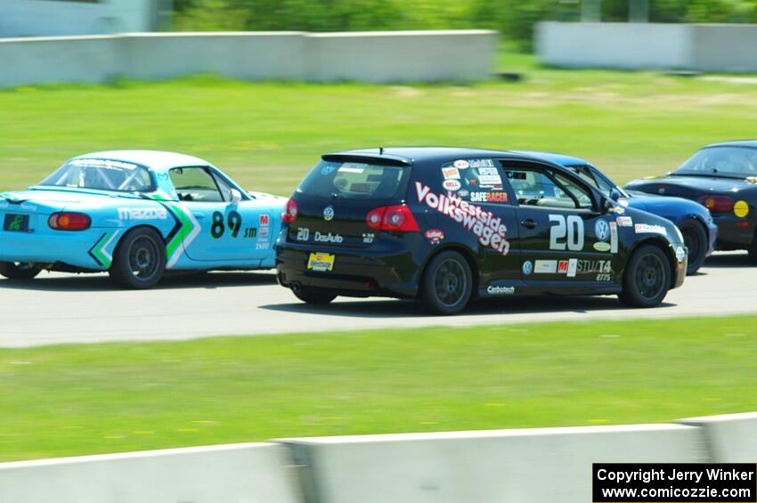 Samantha Silver's Spec Miata Mazda Miata, Tom Daly's T4 VW Rabbit and Jamey Randall's Spec Miata Mazda Miata