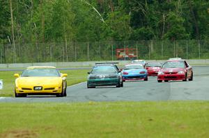 Race Group 2 follows the pace car during Saturday's qualifying race.