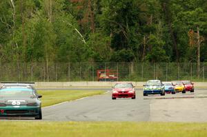 Mark Utecht's STL Honda Civic, Mike Smith's STL Honda Civic Si and John Glowaski's ITA Dodge Neon ACR lead the rest of the pack.