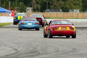 Greg Youngdahl's Spec Miata Mazda Miata chases Rick Buan's Spec Miata Mazda Miata