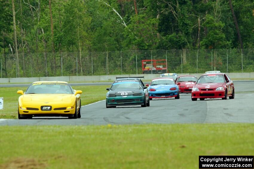 Race Group 2 follows the pace car during Saturday's qualifying race.