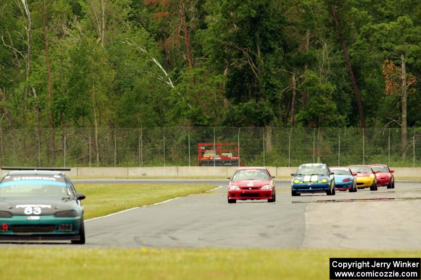 Mark Utecht's STL Honda Civic, Mike Smith's STL Honda Civic Si and John Glowaski's ITA Dodge Neon ACR lead the rest of the pack.