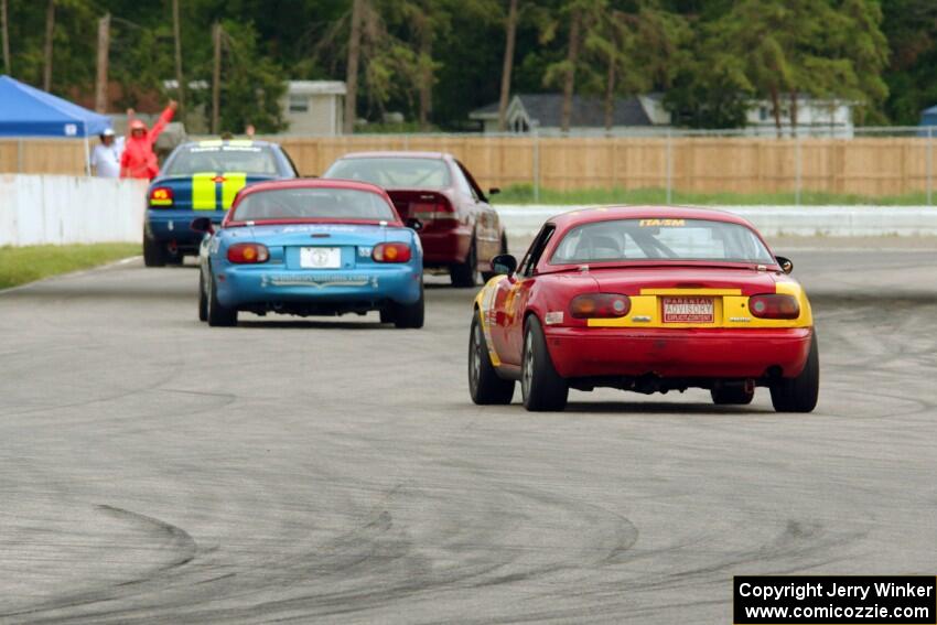 Greg Youngdahl's Spec Miata Mazda Miata chases Rick Buan's Spec Miata Mazda Miata