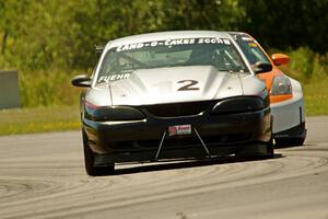 Tom Fuehrer's SPO Ford Mustang and James Berlin's T3 Nissan 350Z