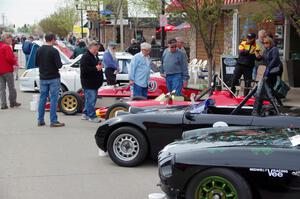 Vintage racing cars lined up on the streets of Osseo.