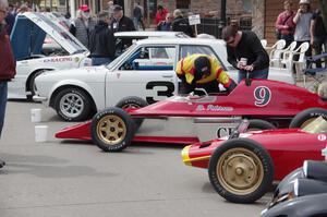 Vintage racing cars lined up on the streets of Osseo.