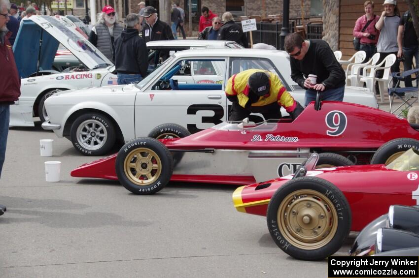 Vintage racing cars lined up on the streets of Osseo.