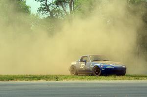 Paul Pridday's Spec Miata Mazda Miata goes off at turn 3.