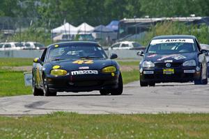 Greg Youngdahl's Spec Miata Mazda Miata and Tom Daly's T4 VW Rabbit