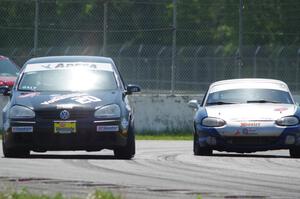 Tom Daly's T4 VW Rabbit and Philip Heald's Spec Miata Mazda Miata