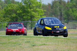 Mark Brakke's H Production Mazda 2 and Lon Blaser's STL Mazda Miata