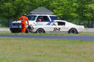 The rescue team comes to the aid of Brian Kennedy's Ford Shelby GT350, stalled at turn 4.